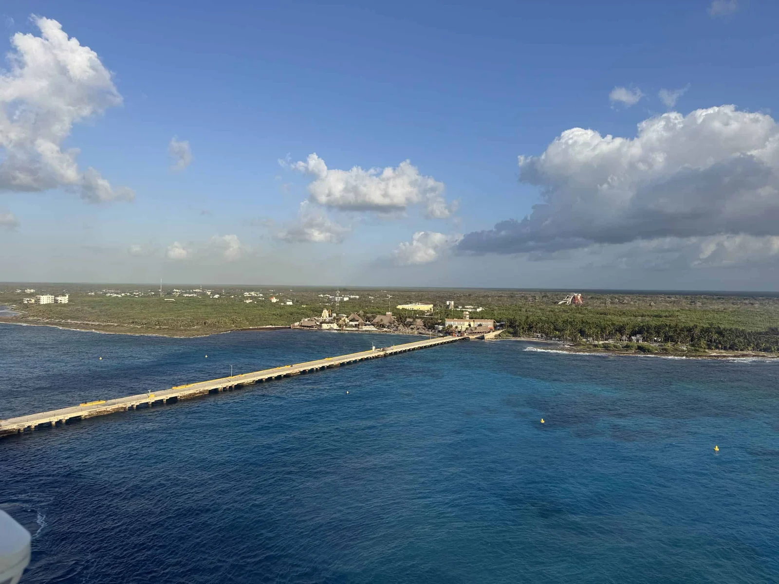 Long pier extending into ocean