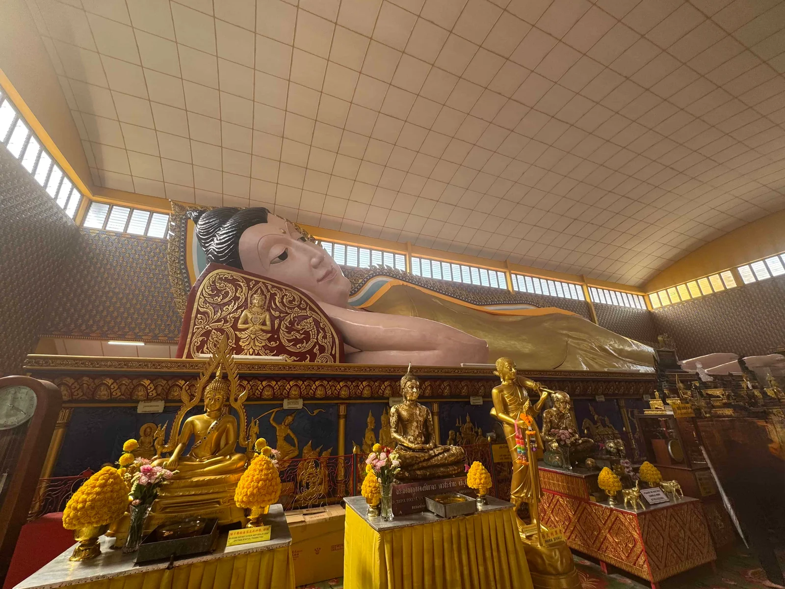 Large reclining Buddha statue indoors