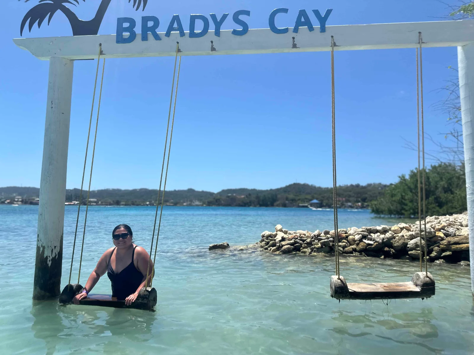 Woman on swing in water