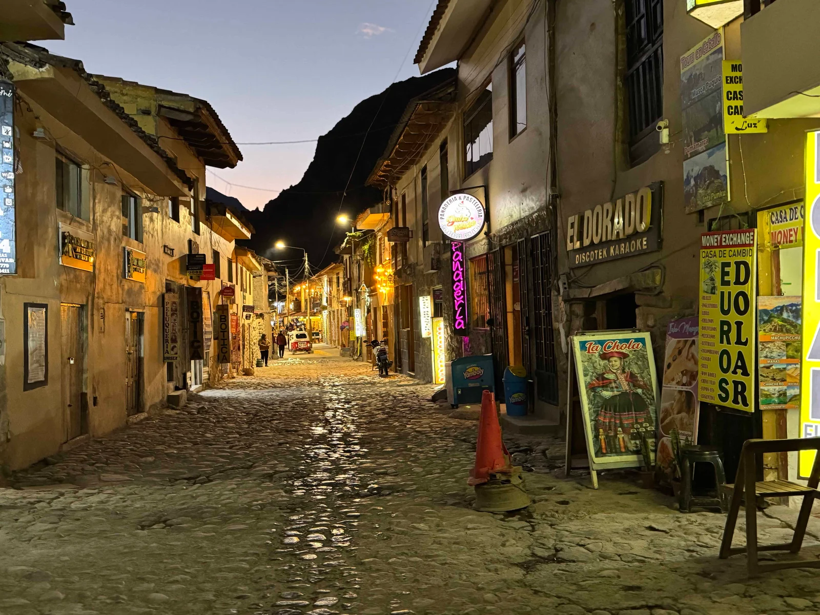 Narrow cobblestone street with shops