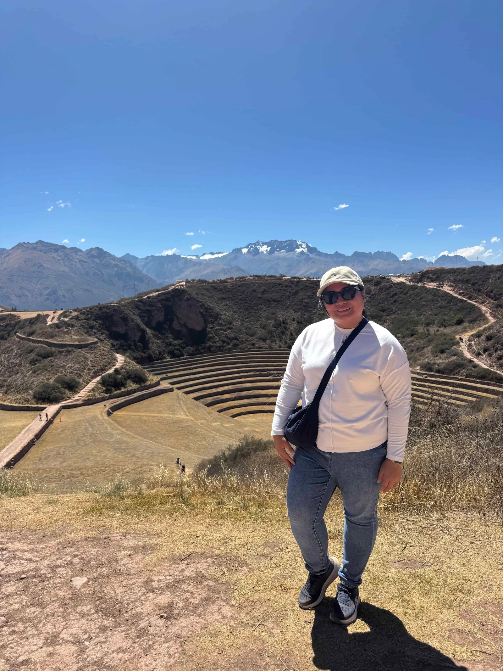 Person standing by mountain terraces
