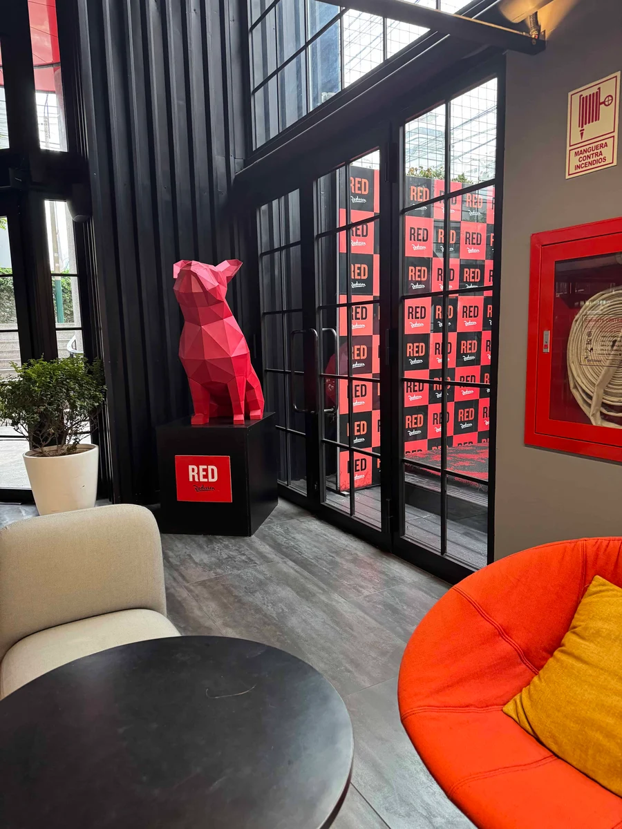 Red geometric dog sculpture indoors