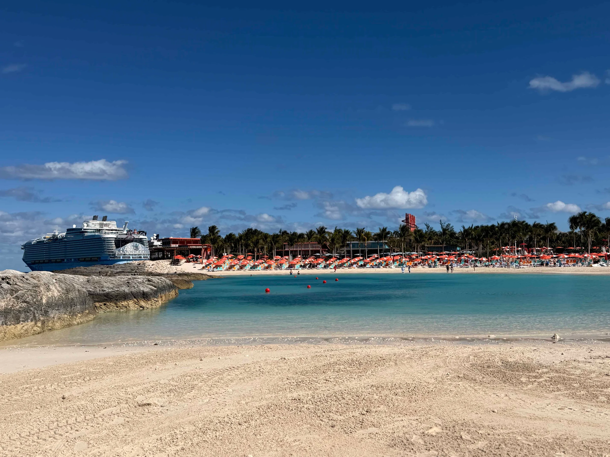 Cruise ship docked at tropical beach