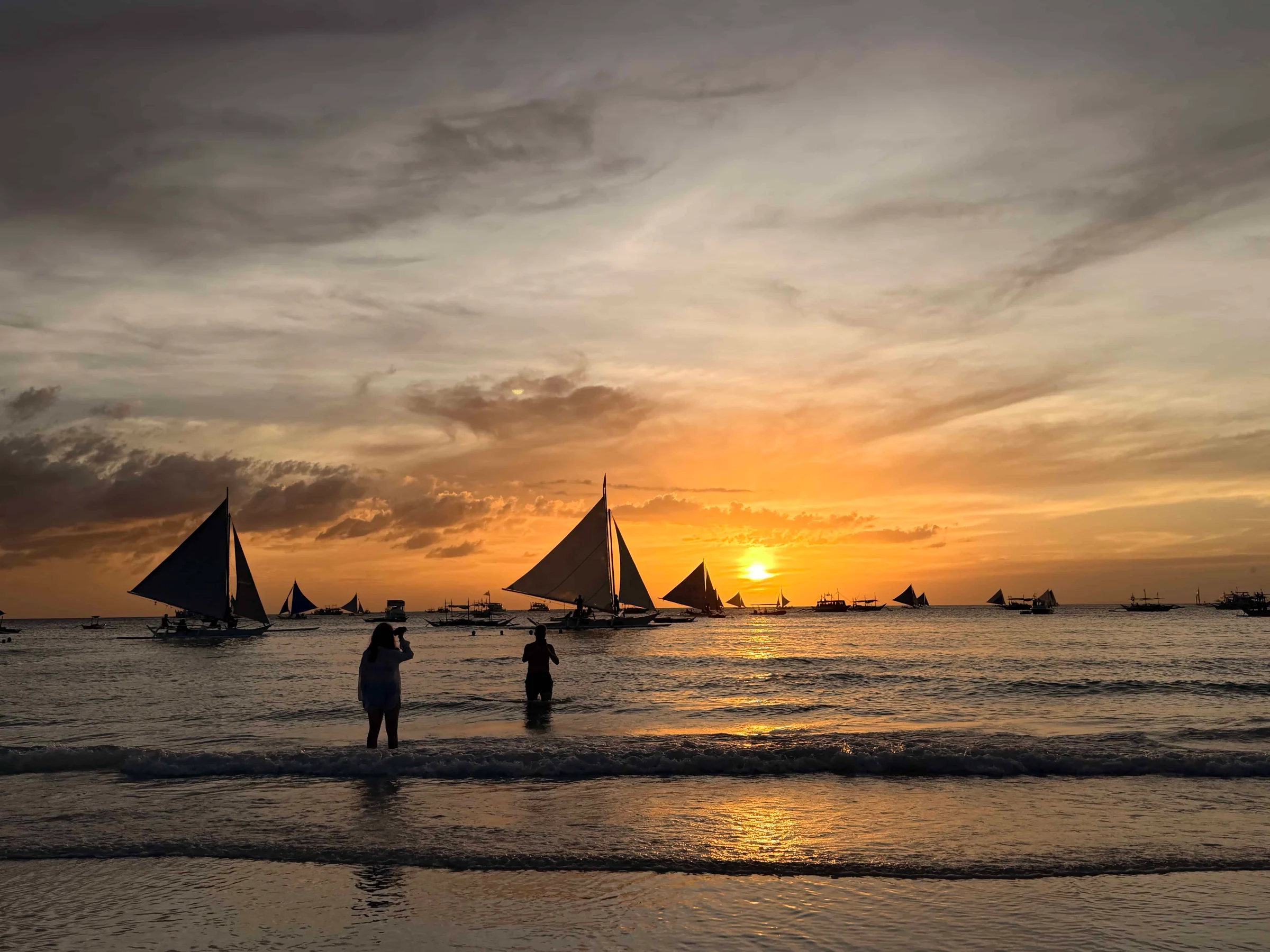 Sailboats on the ocean sunset