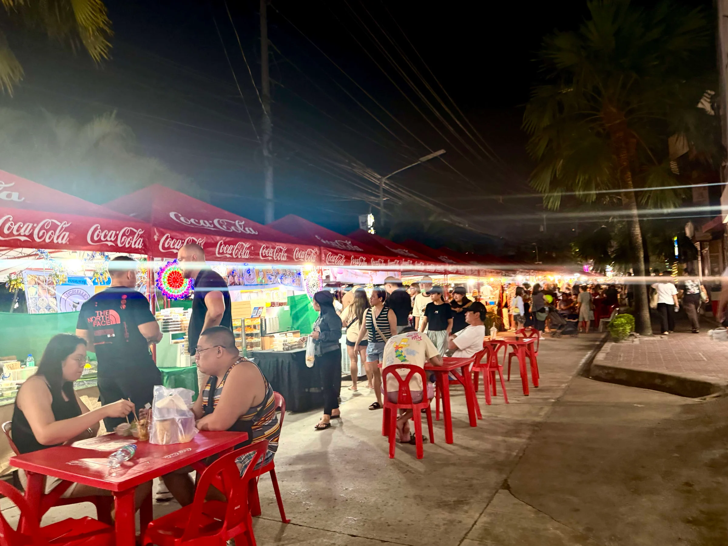 Outdoor night market with food stalls