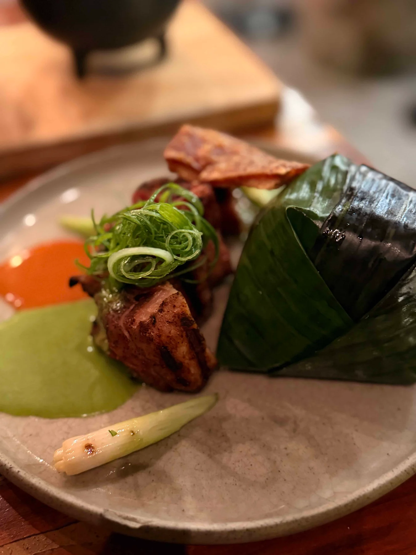 Grilled meat with banana leaf parcel