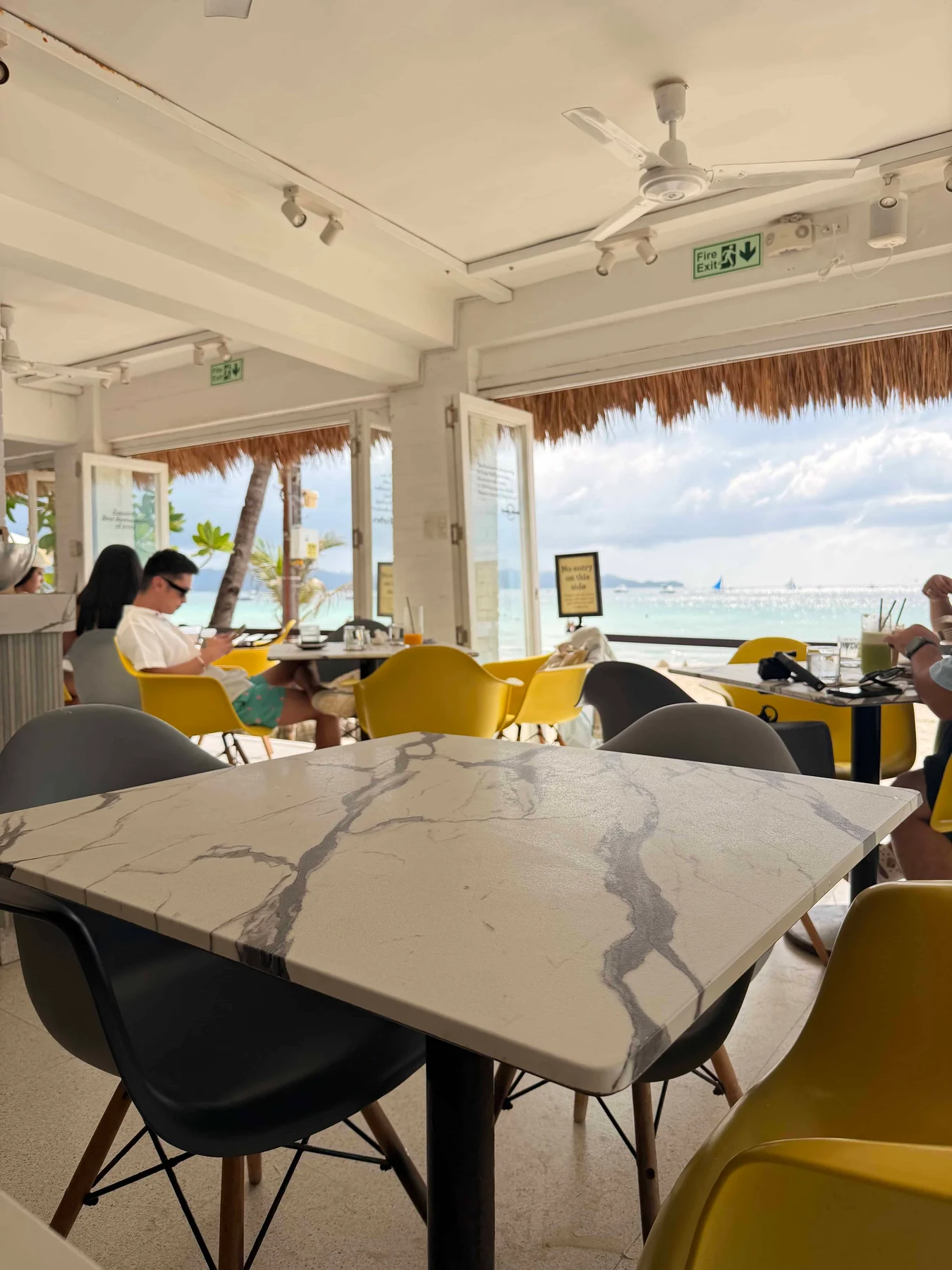 Beachfront café with marble tables