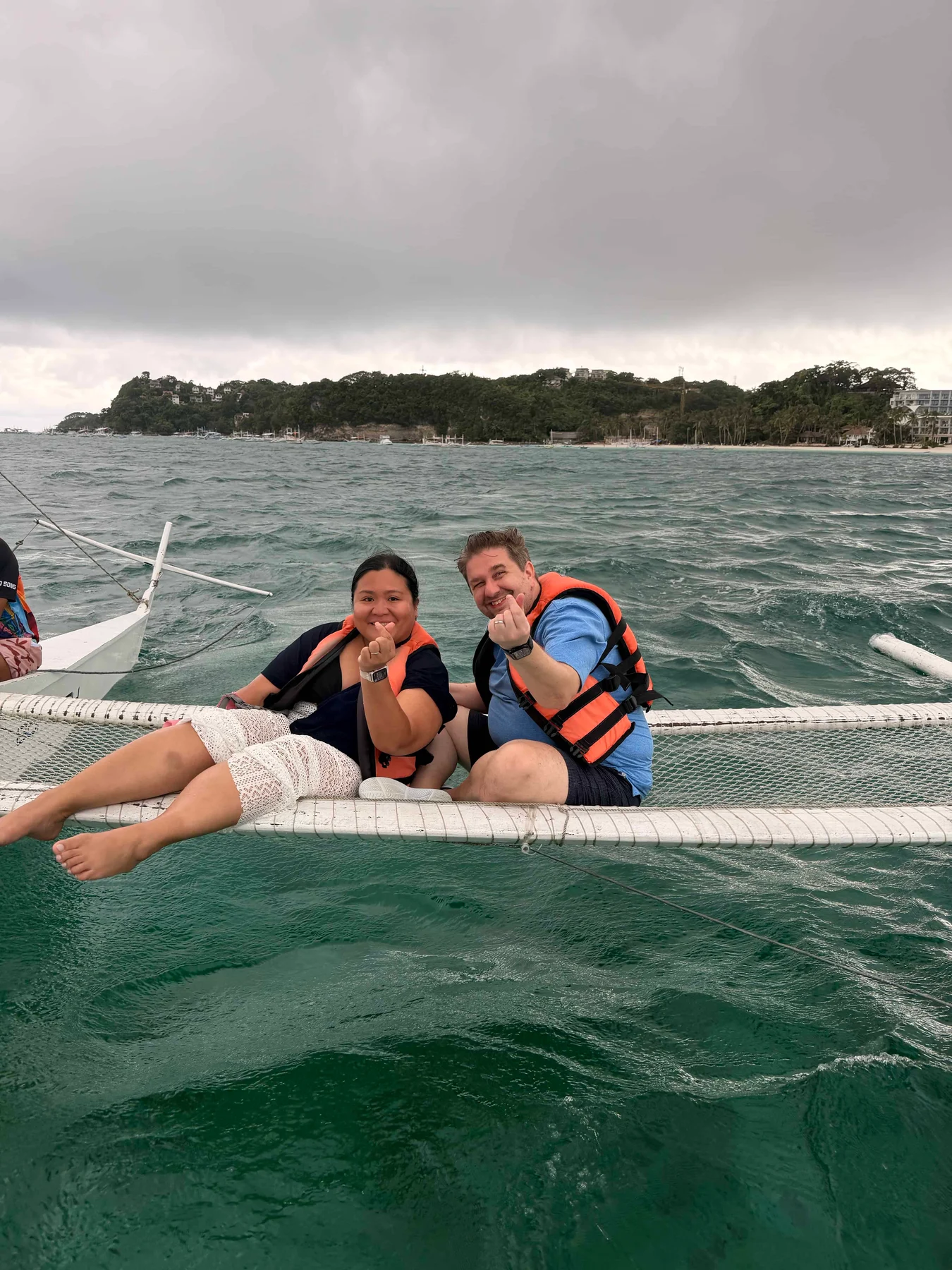 Two people on boat netting