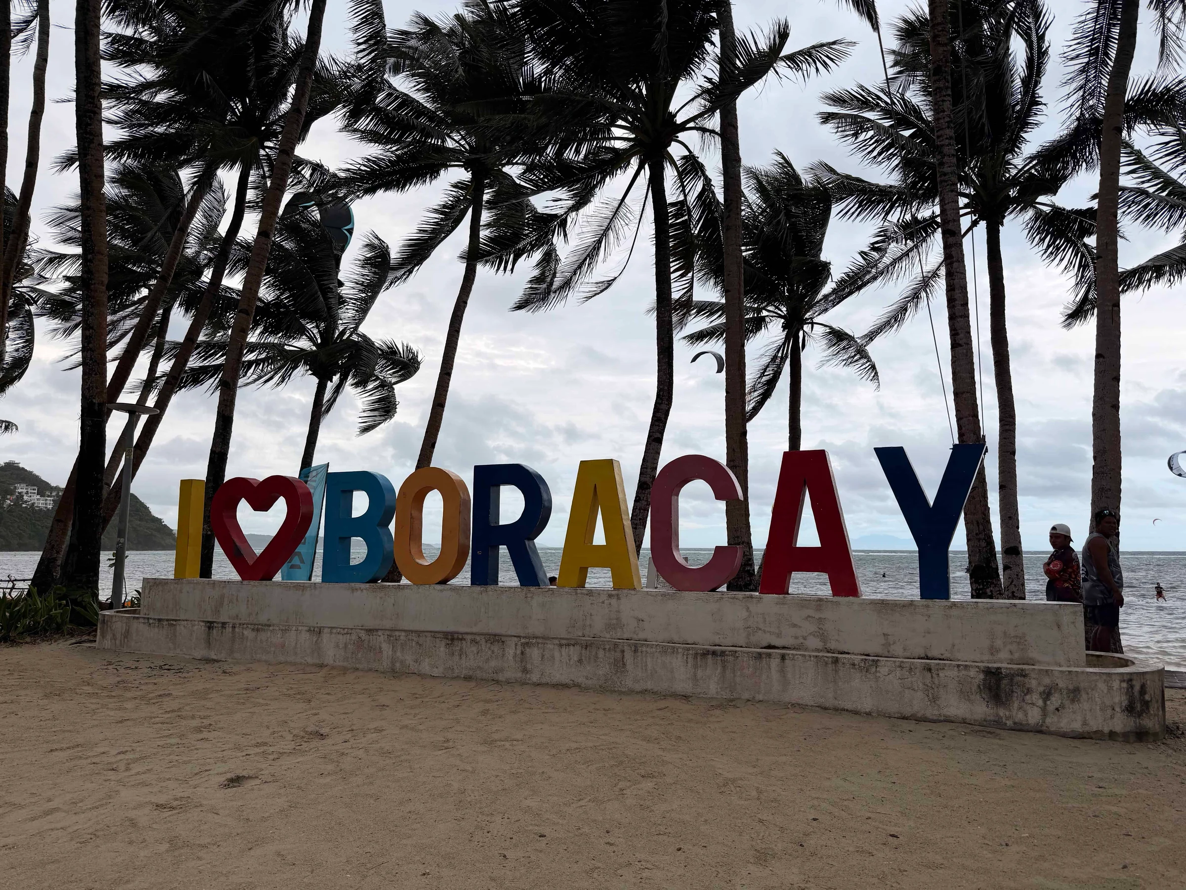 Colourful Boracay beach sign with palms