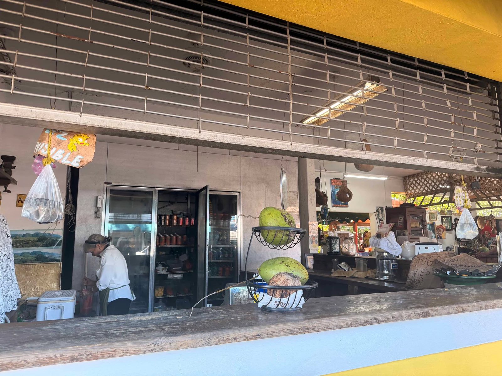 Open-air food stand with coconuts