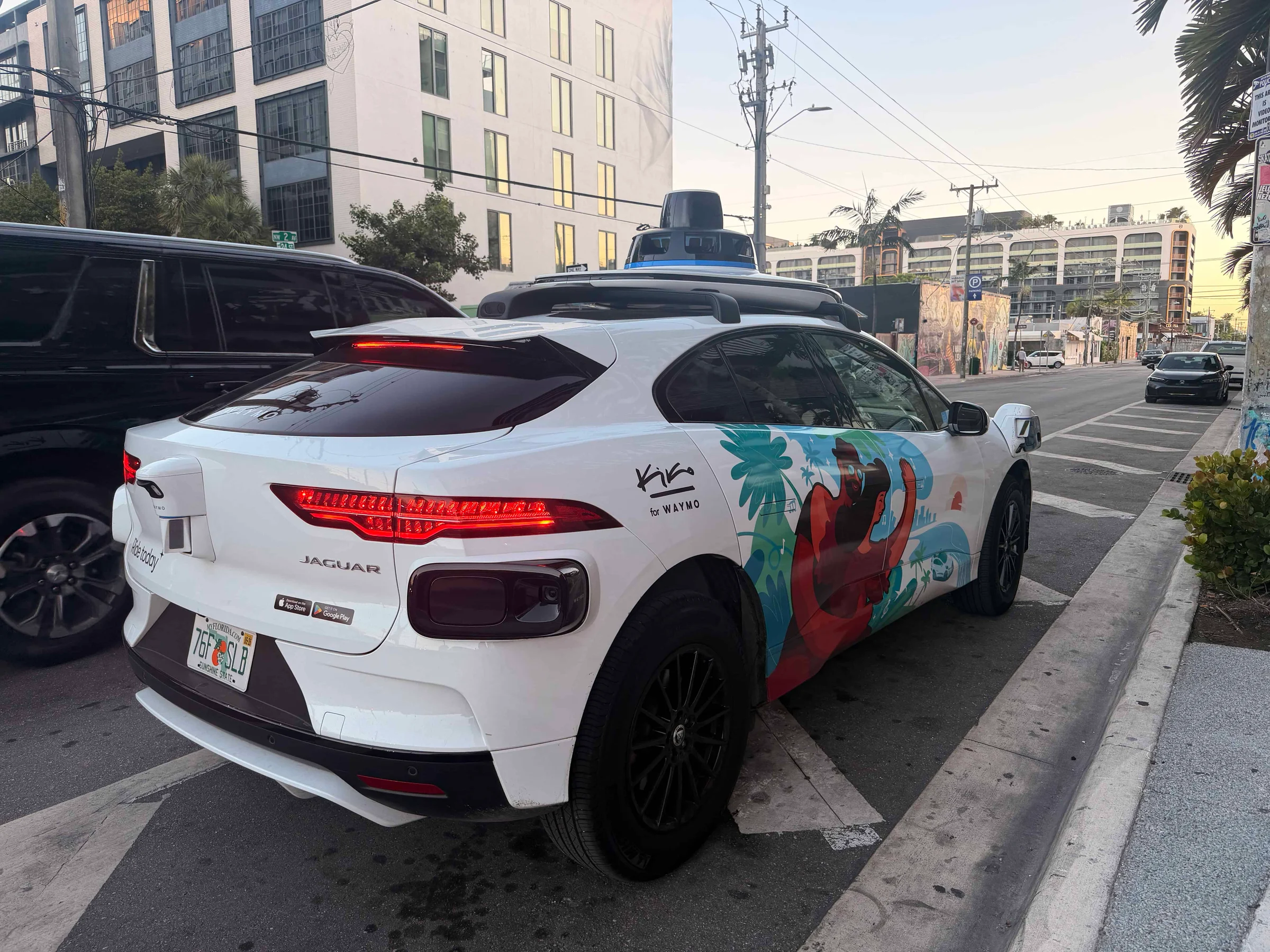White Jaguar Waymo self driving car