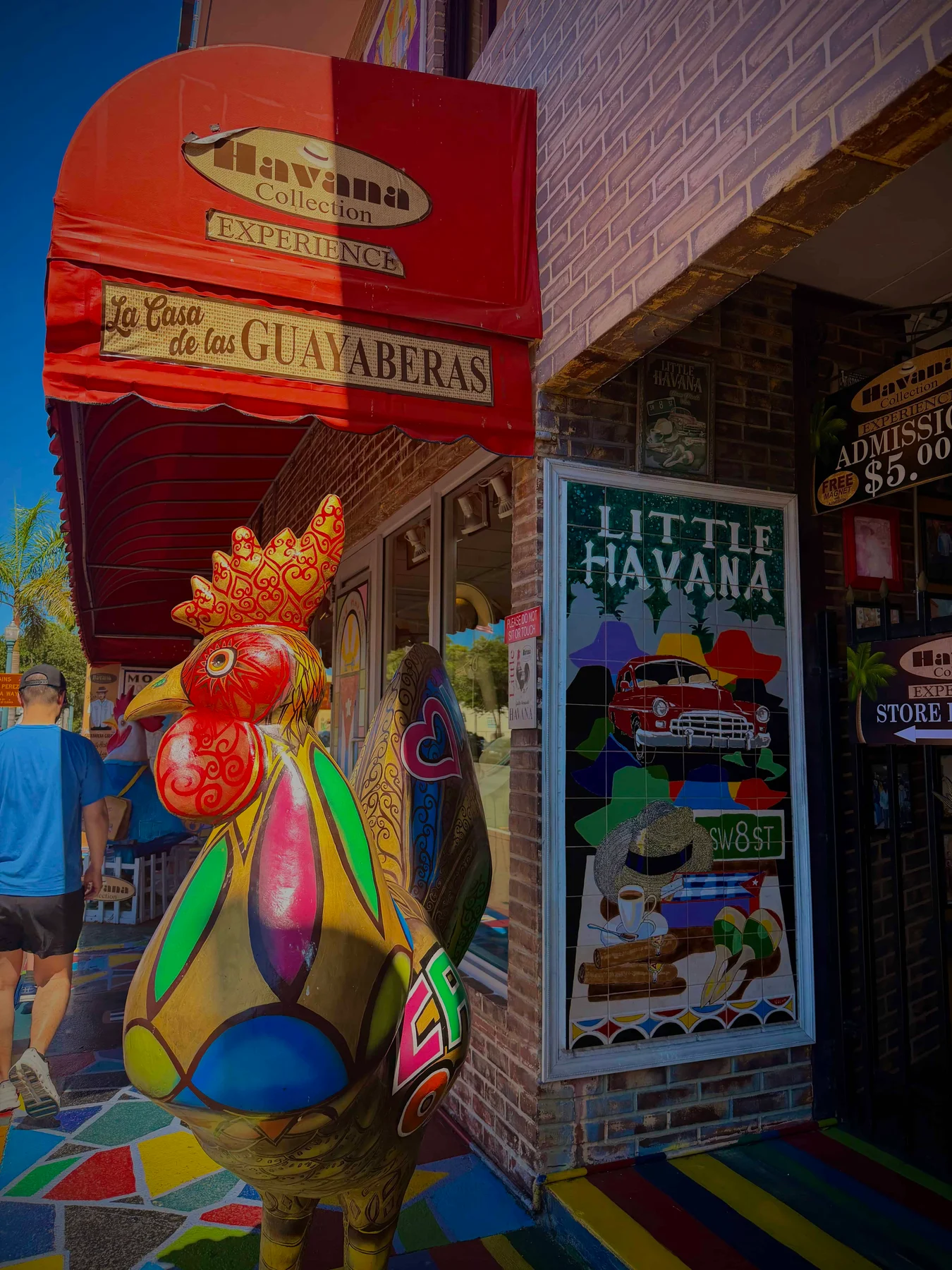 Colourful rooster statue outside shop