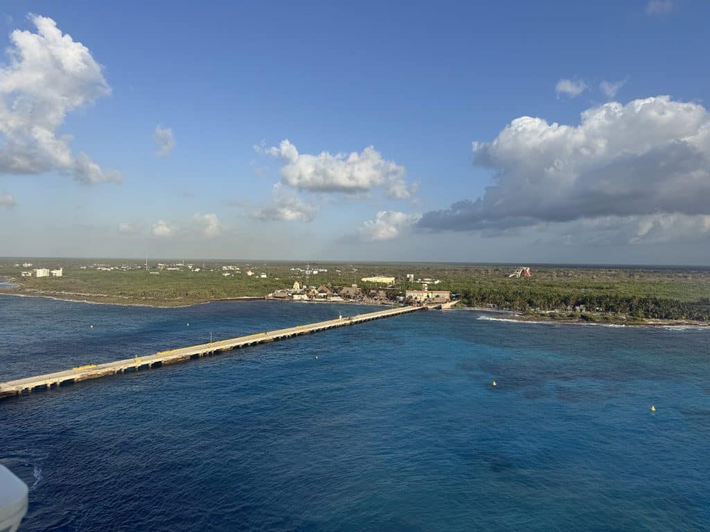 Long pier extending into ocean