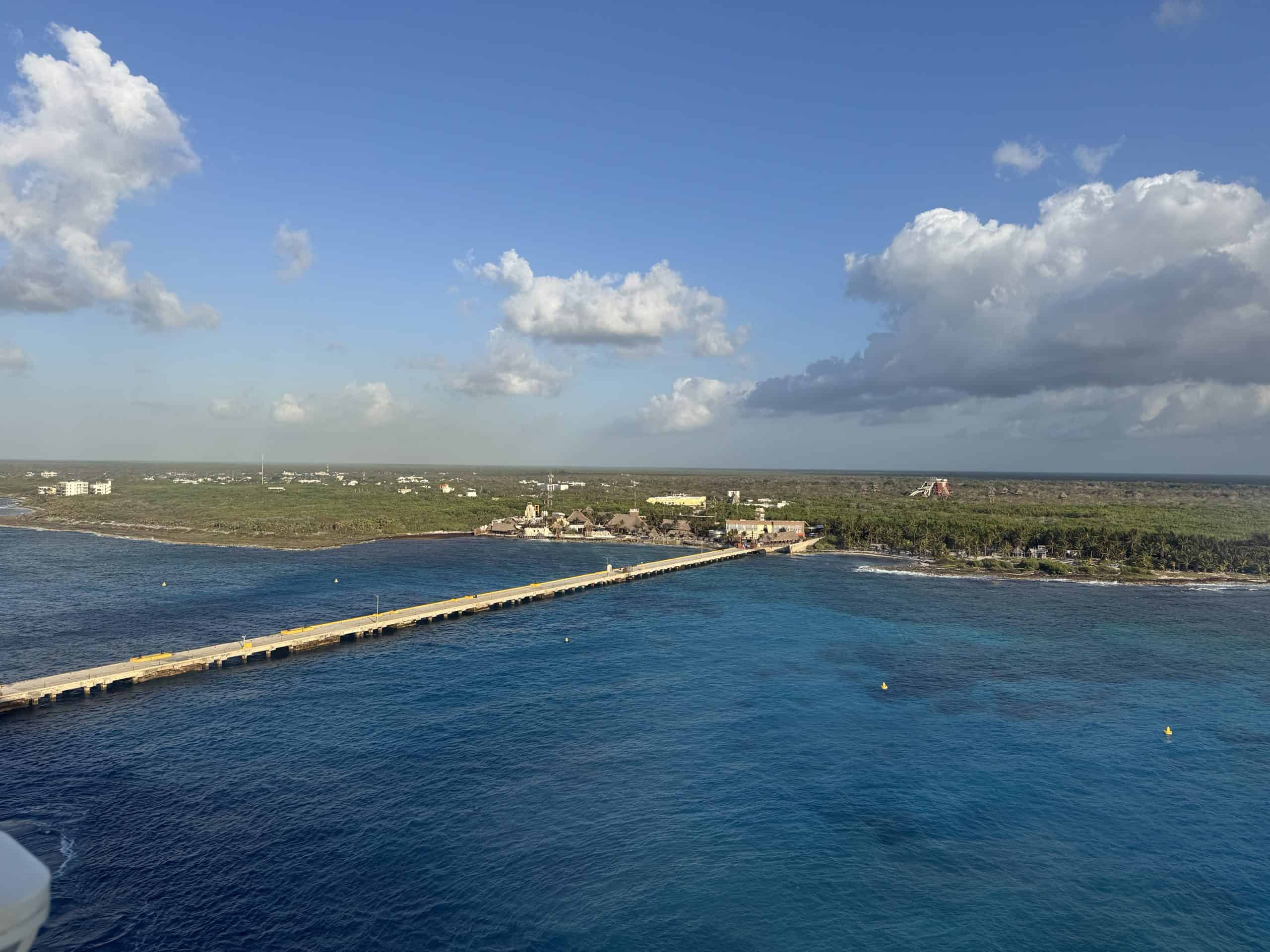 Long pier extending into ocean