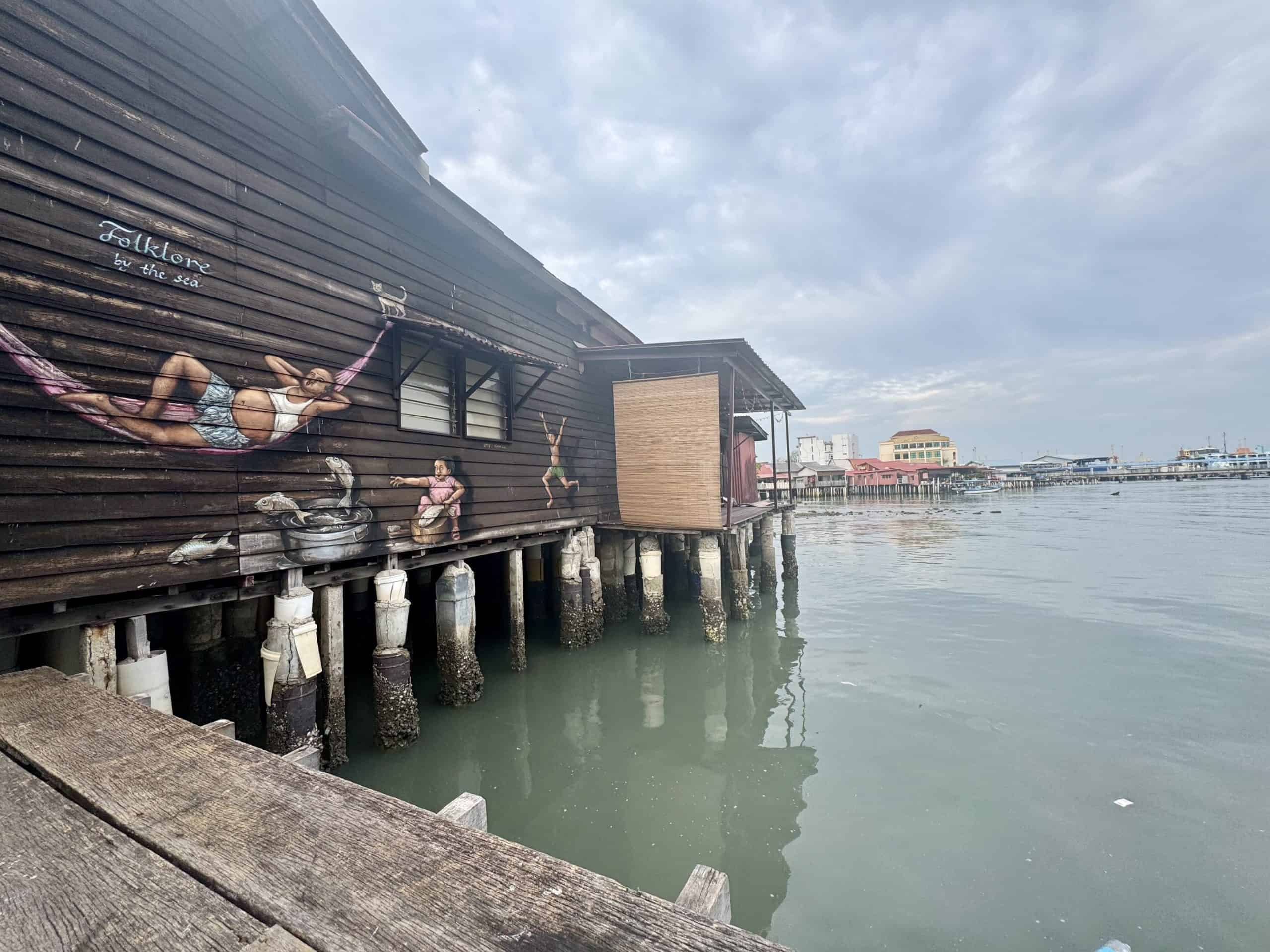 Wooden building on stilts by water