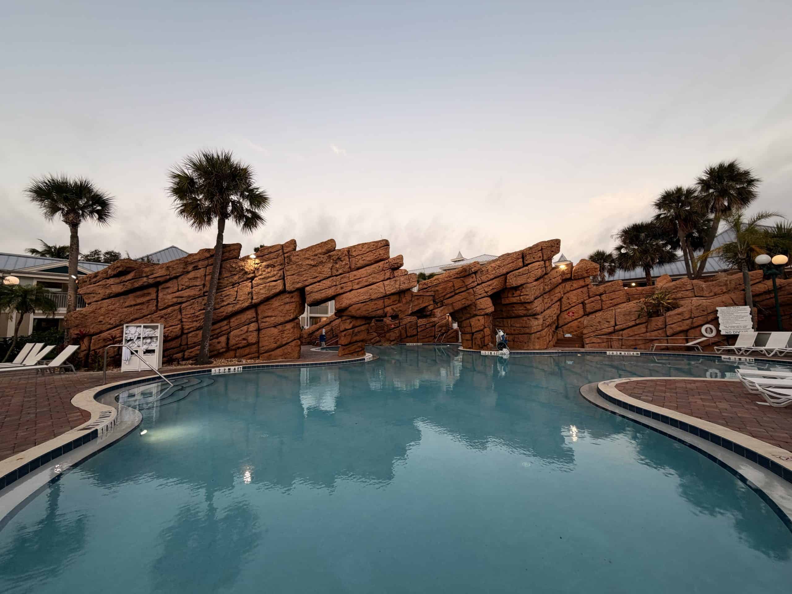 Outdoor swimming pool with rock wall