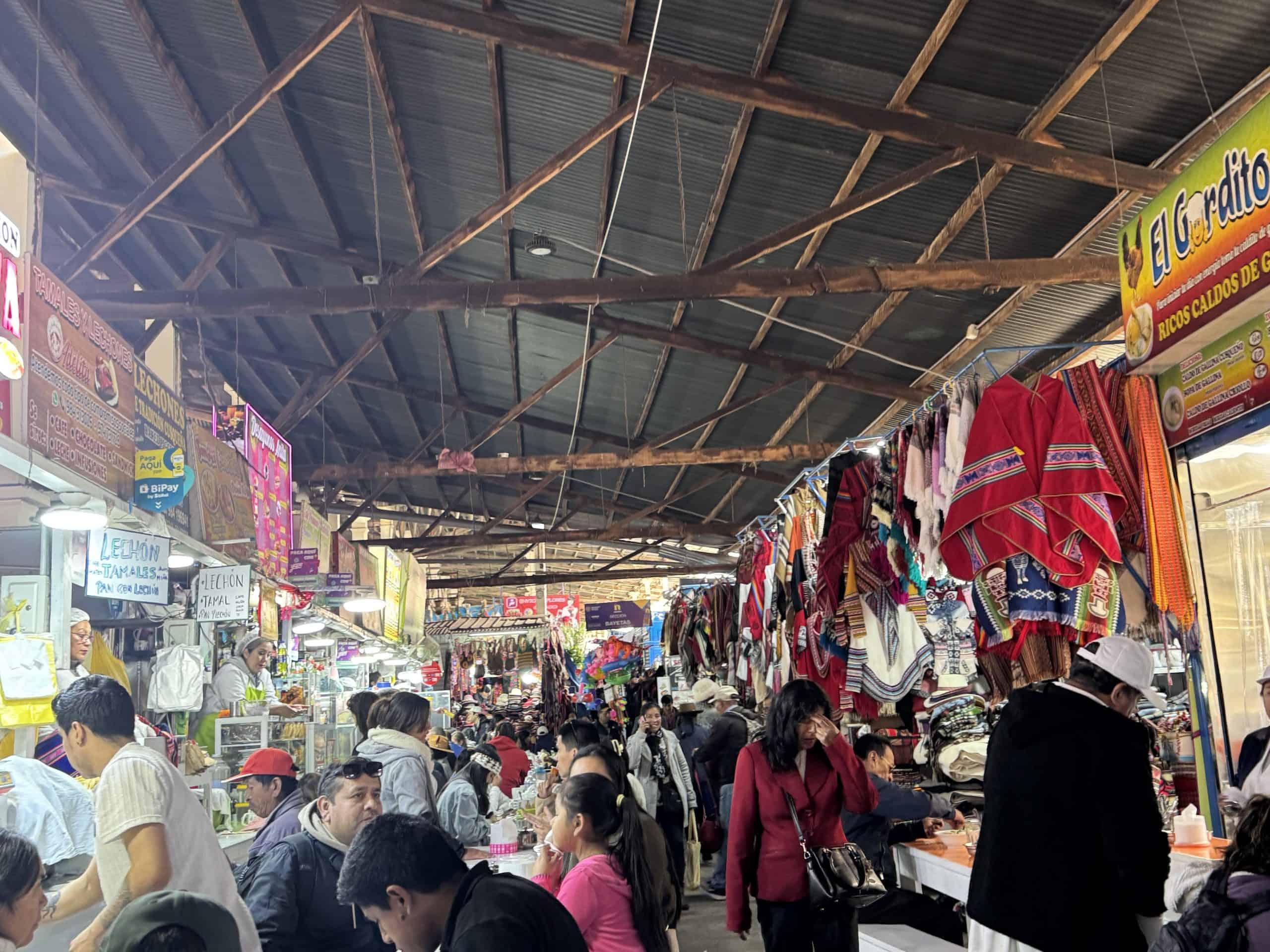 Busy indoor market with clothing