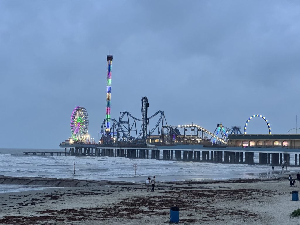 Amusement park on pier over ocean