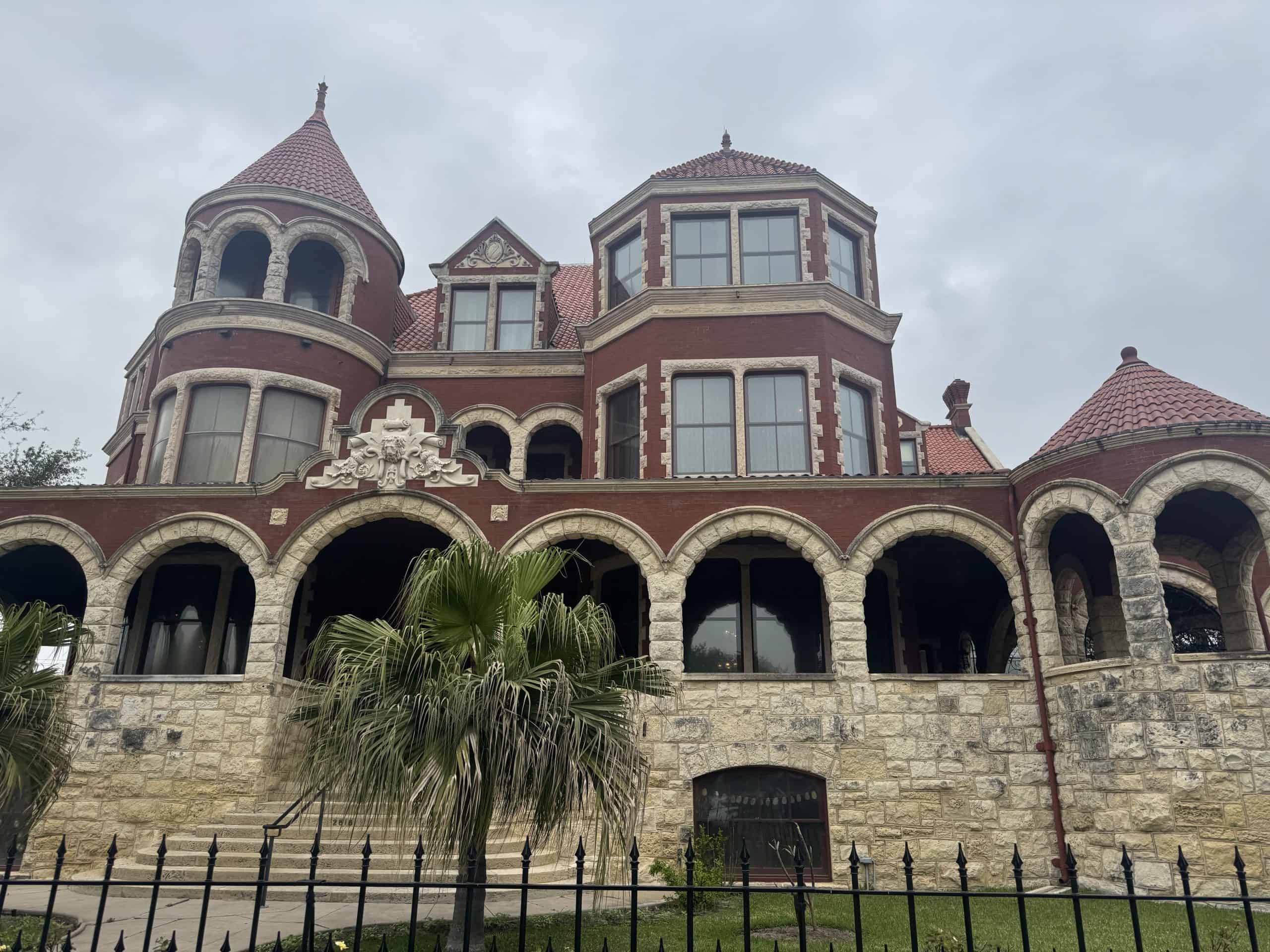 Red brick mansion with turrets