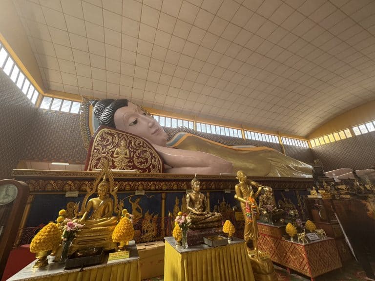 Large reclining Buddha statue indoors