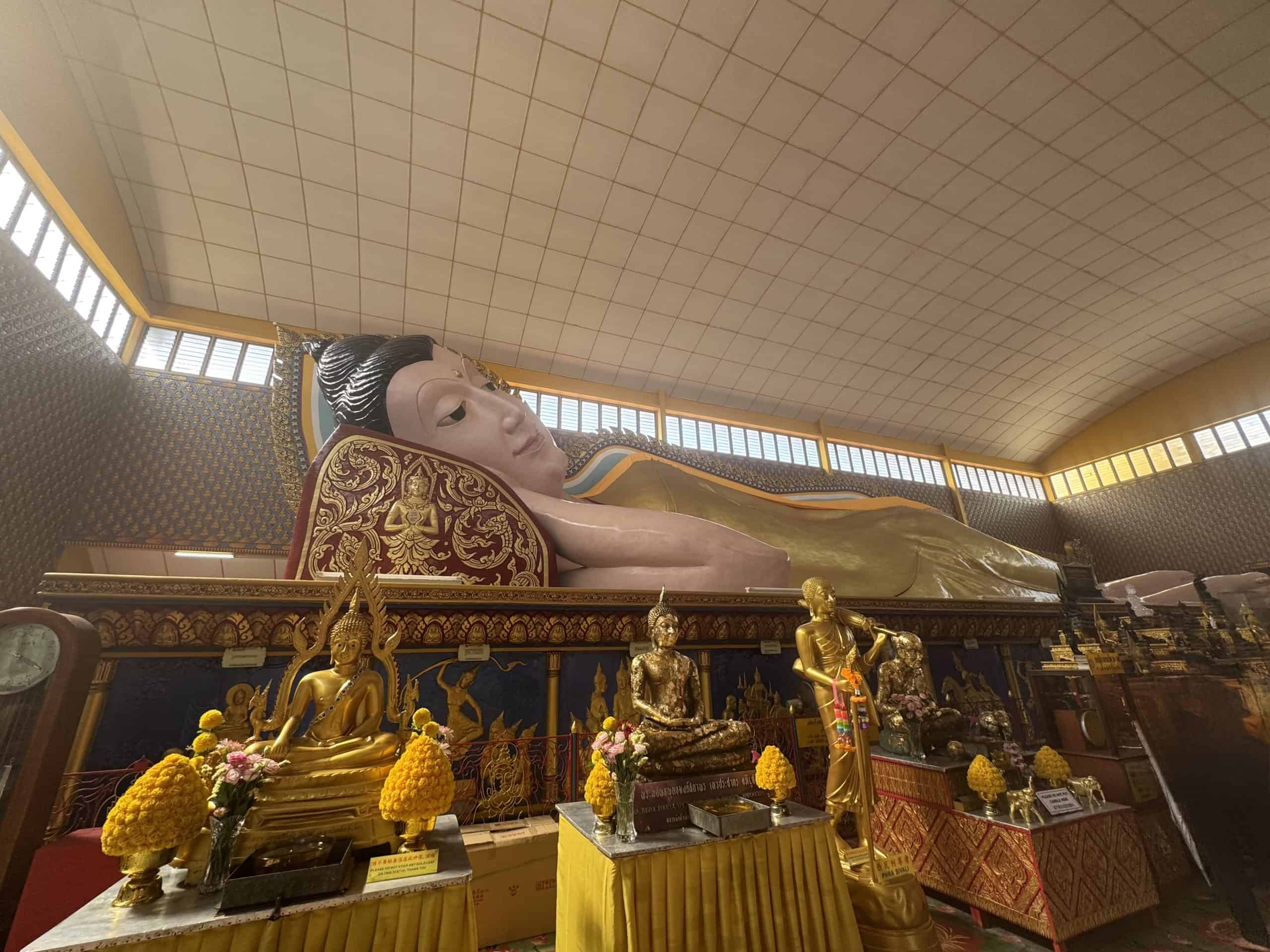 Large reclining Buddha statue indoors