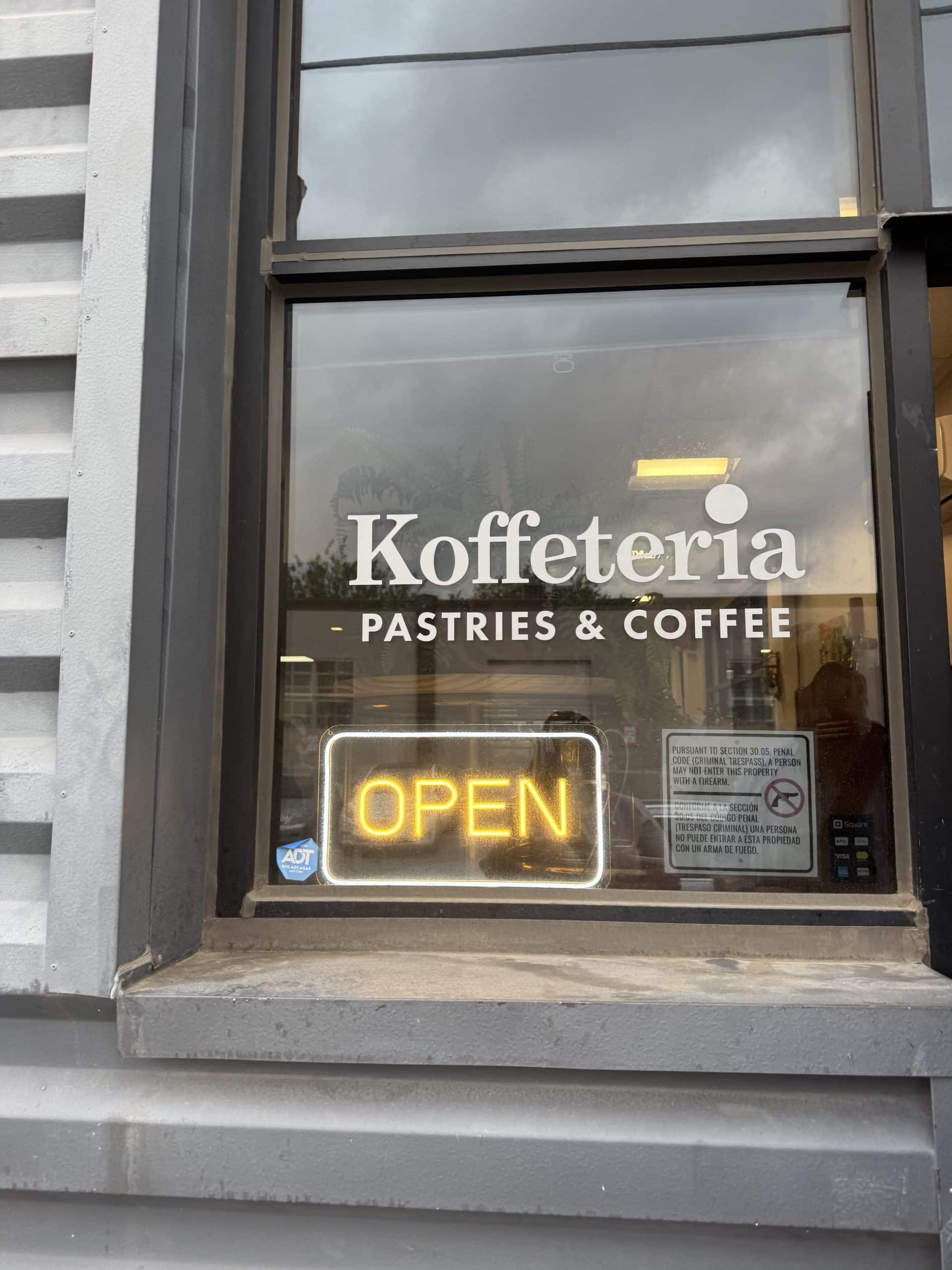 Coffee shop window with neon sign
