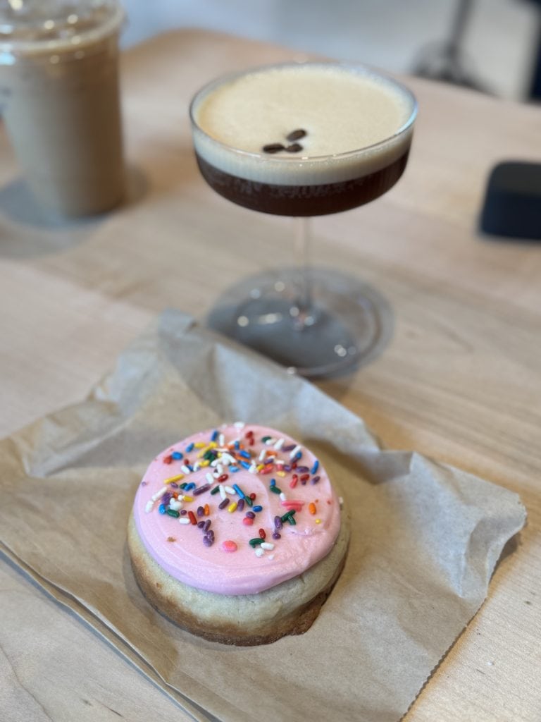 Pink frosted donut with sprinkles
