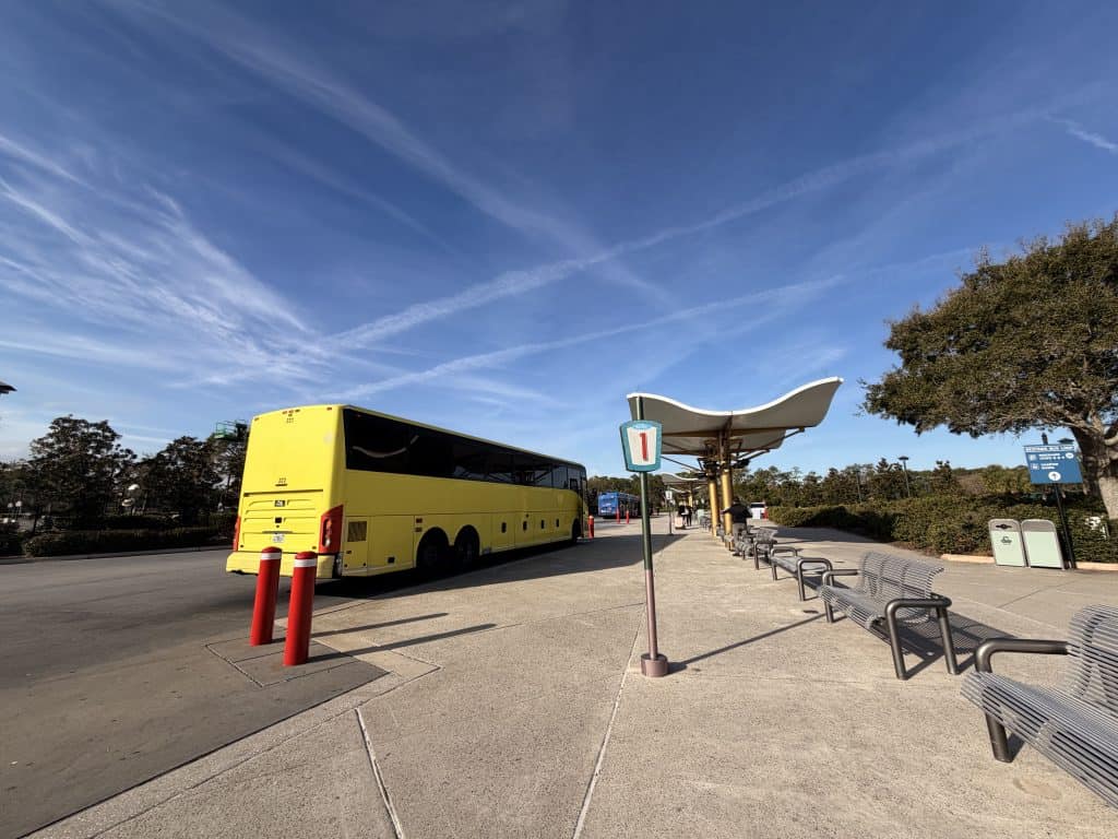 Yellow coach at bus stop