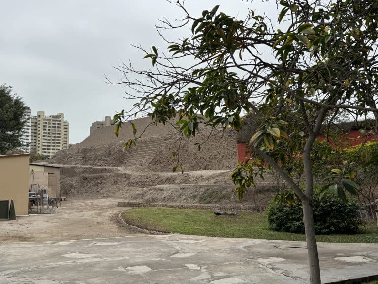 Ancient adobe pyramid in city