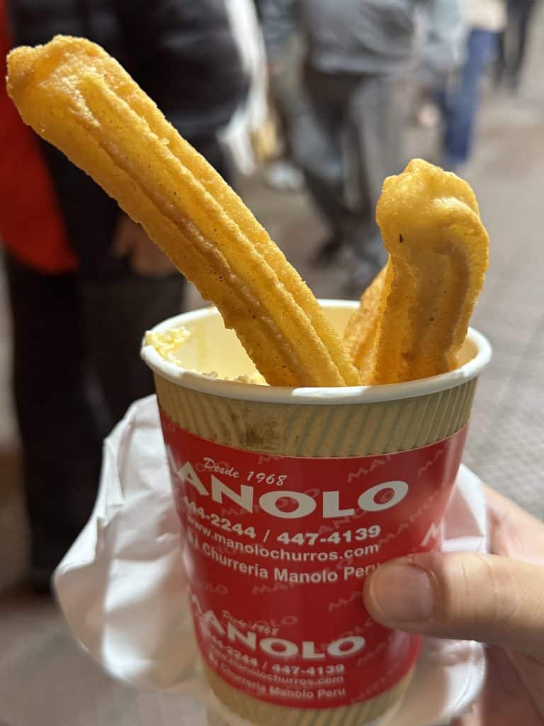 Two churros in a cup