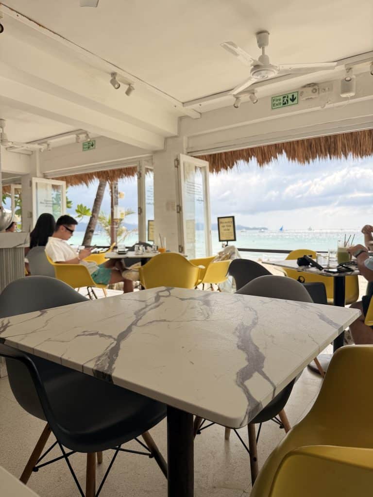 Beachfront café with marble tables