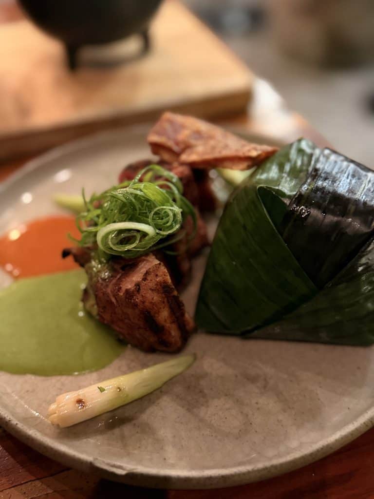 Grilled meat with banana leaf parcel