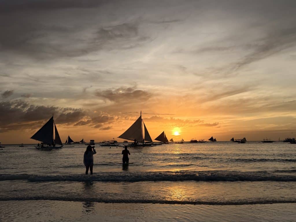 Sailboats on the ocean sunset