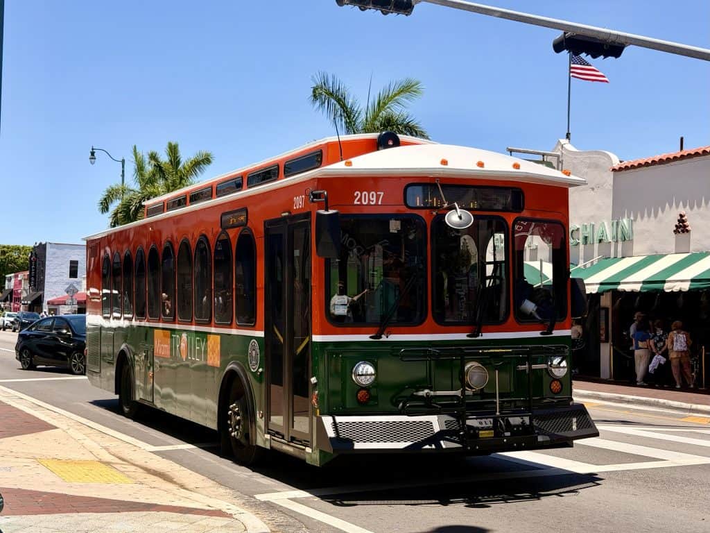 Red and green Miami trolley bus