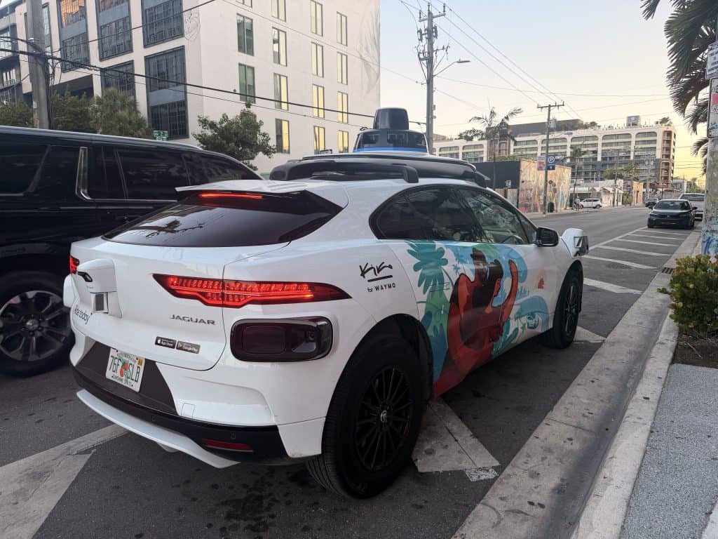 White Jaguar Waymo self driving car