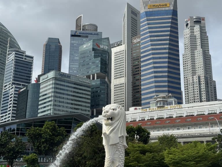 Merlion statue with city skyline