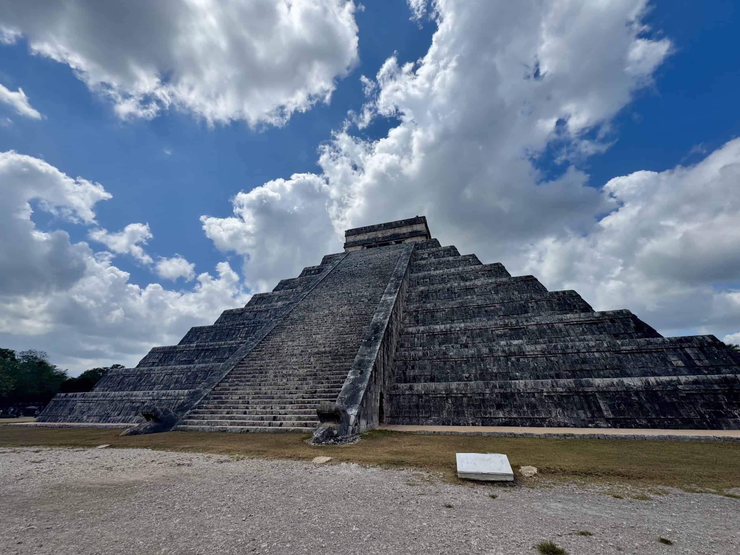 Ancient stone pyramid under blue sky