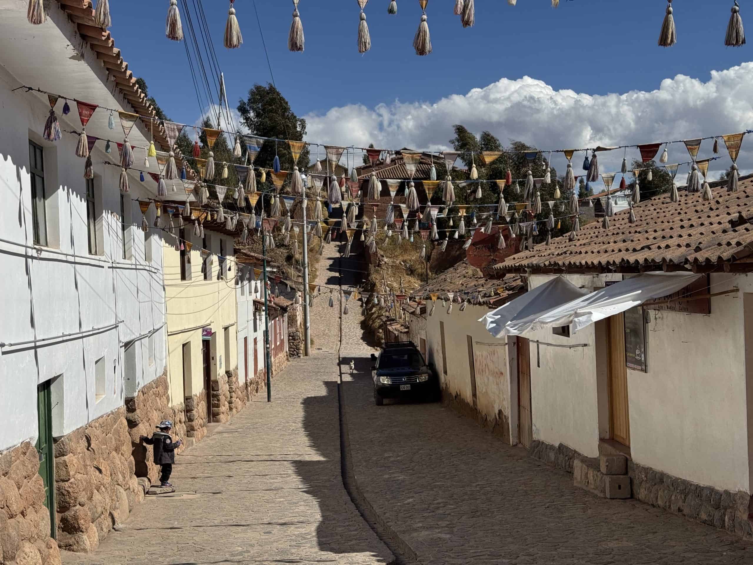 Cobblestone street with colourful flags