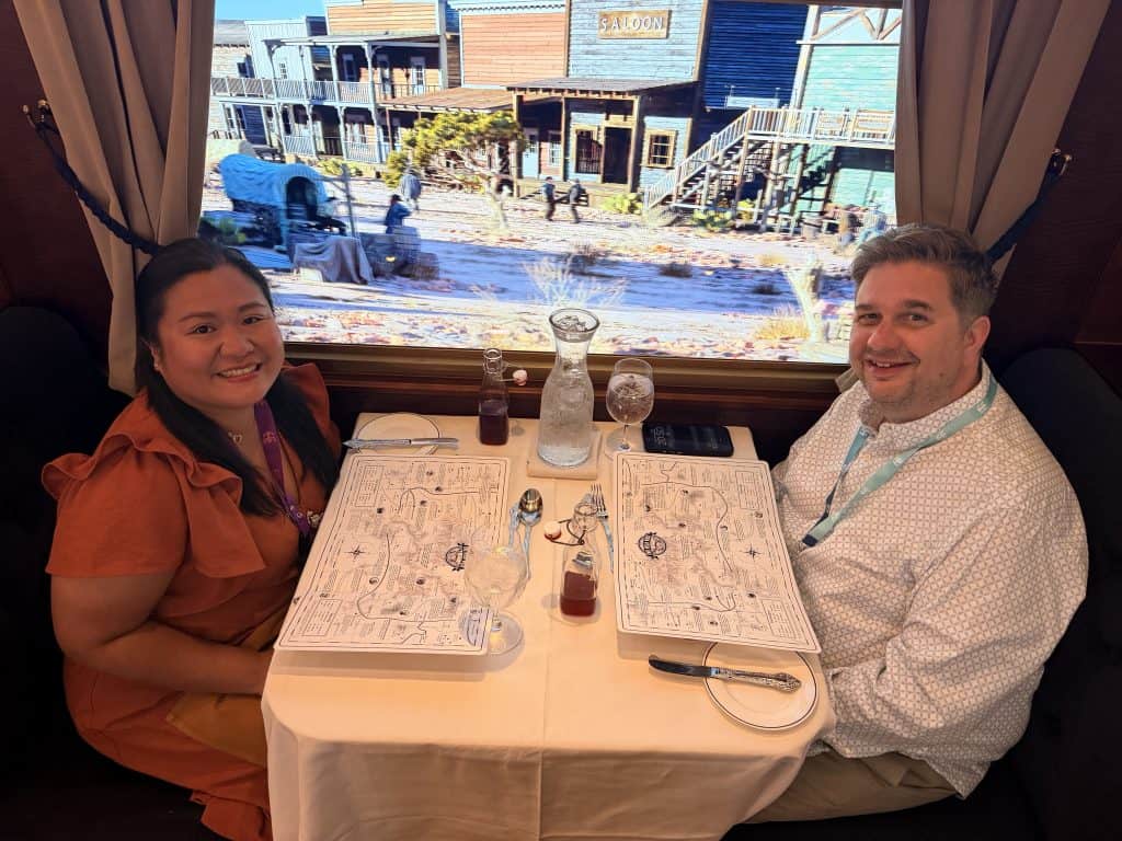 Couple dining with maps onboard
