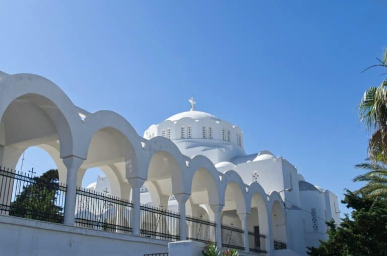 a white building with a fence around it