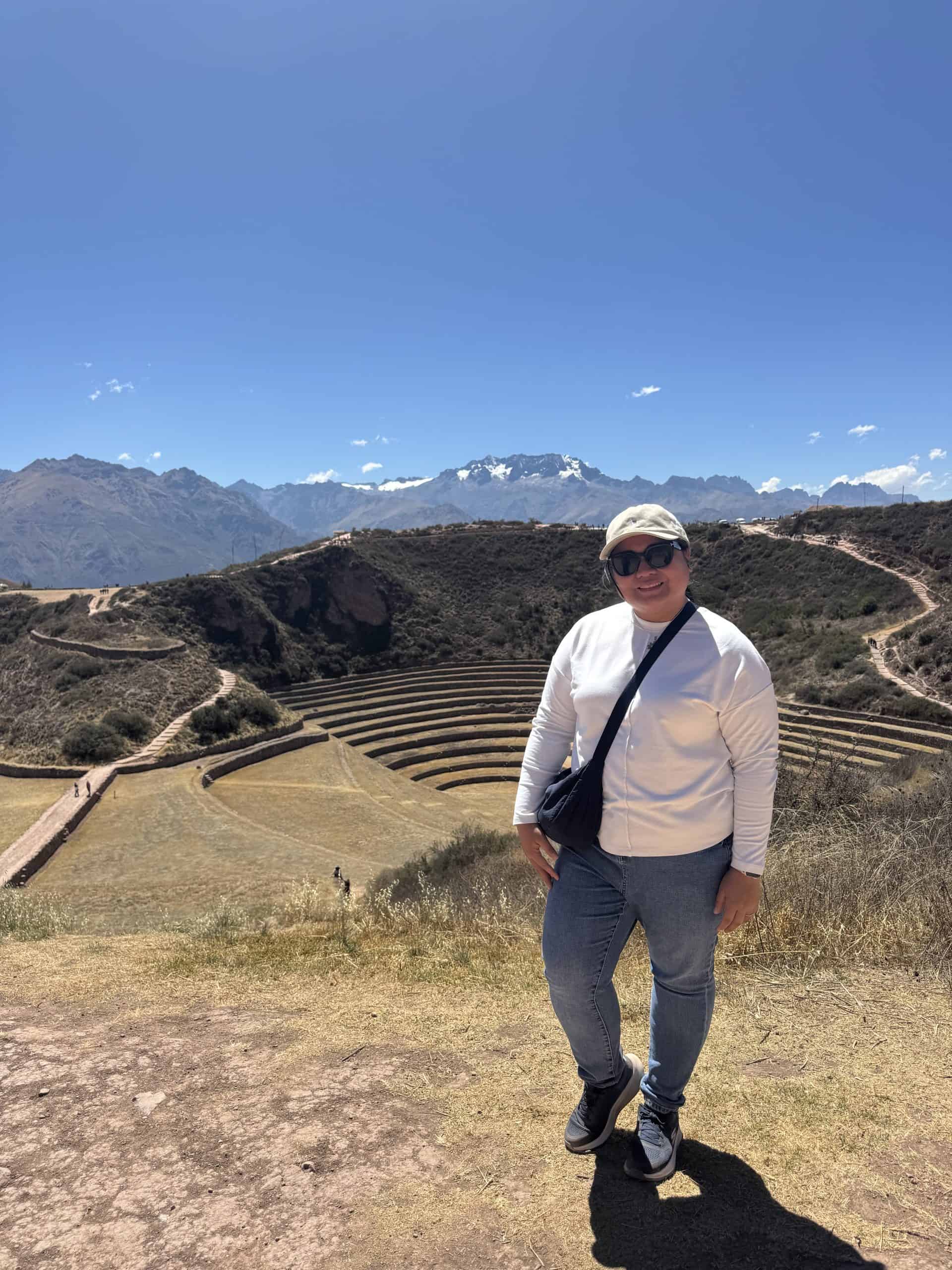 Person standing by mountain terraces
