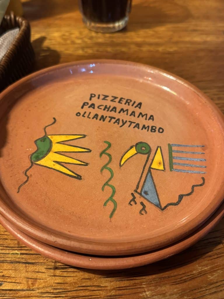 Terracotta plate with colourful bird design