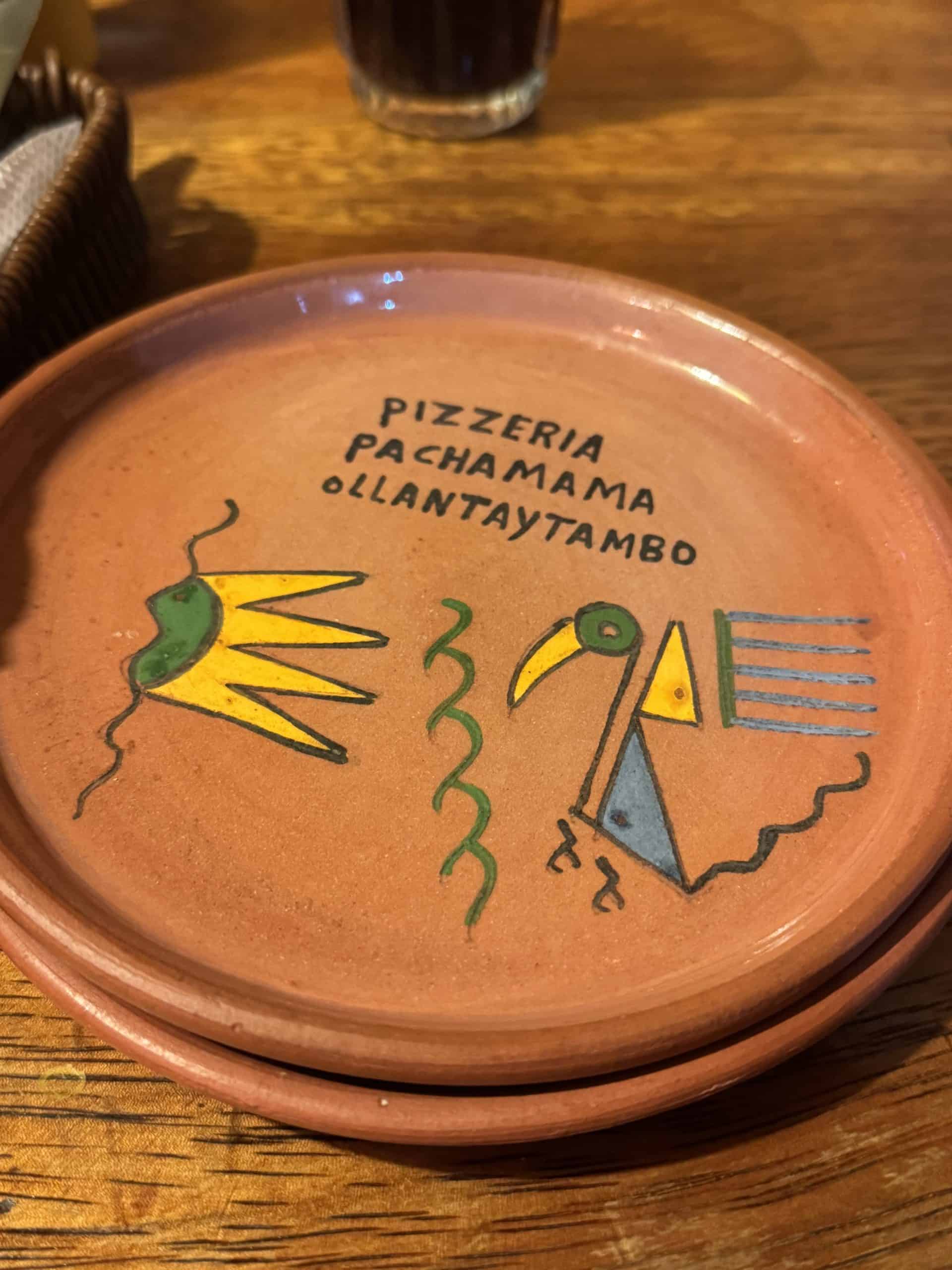 Terracotta plate with colourful bird design
