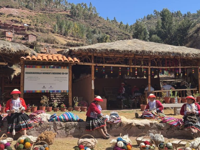 Women weaving textiles outdoors